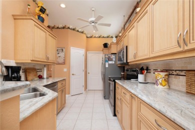 Exceptional value and privacy await! This extended Antiqua model on Seminole Lakes Country Club in Florida - for sale on GolfHomes.com, golf home, golf lot