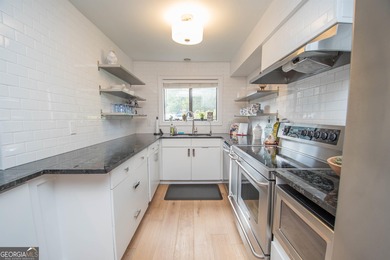 LAKEFRONT LIVING IN THE HEART OF PEACHTREE CITY! Welcome to this on Canongate At Flat Creek Club in Georgia - for sale on GolfHomes.com, golf home, golf lot