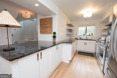 LAKEFRONT LIVING IN THE HEART OF PEACHTREE CITY! Welcome to this on Canongate At Flat Creek Club in Georgia - for sale on GolfHomes.com, golf home, golf lot