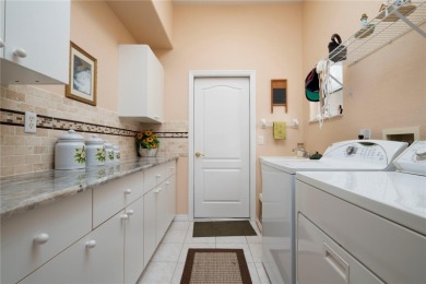 Exceptional value and privacy await! This extended Antiqua model on Seminole Lakes Country Club in Florida - for sale on GolfHomes.com, golf home, golf lot