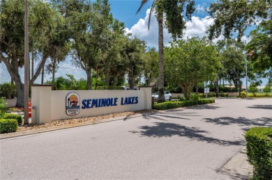 Exceptional value and privacy await! This extended Antiqua model on Seminole Lakes Country Club in Florida - for sale on GolfHomes.com, golf home, golf lot