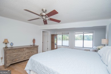 LAKEFRONT LIVING IN THE HEART OF PEACHTREE CITY! Fully furnished on Canongate At Flat Creek Club in Georgia - for sale on GolfHomes.com, golf home, golf lot