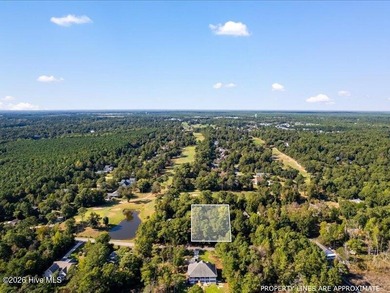 This .63 acre golf front lot gives you the space to build the on Olde Point Golf and Country Club in North Carolina - for sale on GolfHomes.com, golf home, golf lot