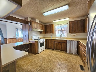 A well-kept spacious home nestled in a beautiful 55+ community on Sun Lakes Country Club in California - for sale on GolfHomes.com, golf home, golf lot