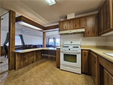 A well-kept spacious home nestled in a beautiful 55+ community on Sun Lakes Country Club in California - for sale on GolfHomes.com, golf home, golf lot