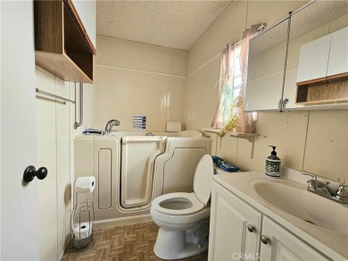 A well-kept spacious home nestled in a beautiful 55+ community on Sun Lakes Country Club in California - for sale on GolfHomes.com, golf home, golf lot