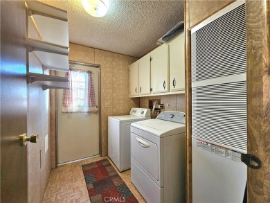 A well-kept spacious home nestled in a beautiful 55+ community on Sun Lakes Country Club in California - for sale on GolfHomes.com, golf home, golf lot