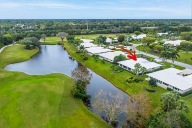 Shimmering lake and golf course views from this luxurious 3 on Pine Tree Golf Club in Florida - for sale on GolfHomes.com, golf home, golf lot
