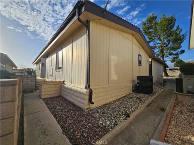 A well-kept spacious home nestled in a beautiful 55+ community on Sun Lakes Country Club in California - for sale on GolfHomes.com, golf home, golf lot