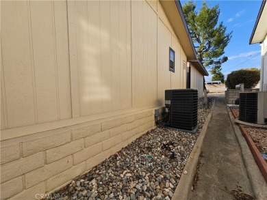 A well-kept spacious home nestled in a beautiful 55+ community on Sun Lakes Country Club in California - for sale on GolfHomes.com, golf home, golf lot