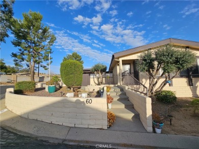 A well-kept spacious home nestled in a beautiful 55+ community on Sun Lakes Country Club in California - for sale on GolfHomes.com, golf home, golf lot