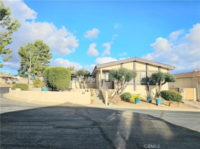 A well-kept spacious home nestled in a beautiful 55+ community on Sun Lakes Country Club in California - for sale on GolfHomes.com, golf home, golf lot