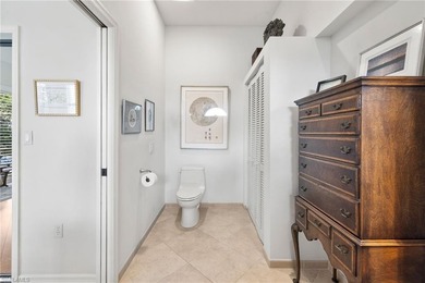 Enjoy spectacular panoramic lake and golf course views from this on Windstar on Naples Bay in Florida - for sale on GolfHomes.com, golf home, golf lot