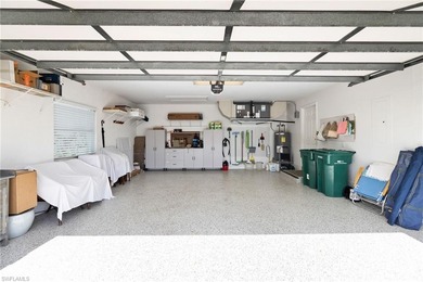 Enjoy spectacular panoramic lake and golf course views from this on Windstar on Naples Bay in Florida - for sale on GolfHomes.com, golf home, golf lot