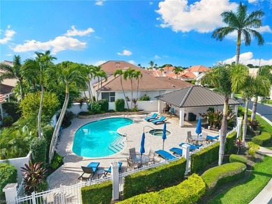 Enjoy spectacular panoramic lake and golf course views from this on Windstar on Naples Bay in Florida - for sale on GolfHomes.com, golf home, golf lot