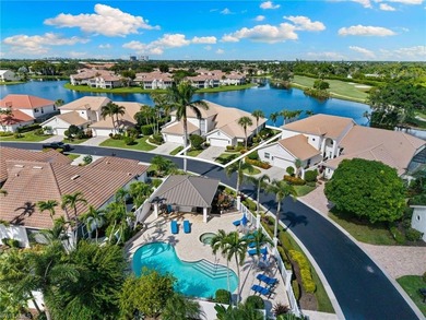 Enjoy spectacular panoramic lake and golf course views from this on Windstar on Naples Bay in Florida - for sale on GolfHomes.com, golf home, golf lot