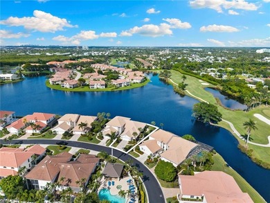 Enjoy spectacular panoramic lake and golf course views from this on Windstar on Naples Bay in Florida - for sale on GolfHomes.com, golf home, golf lot