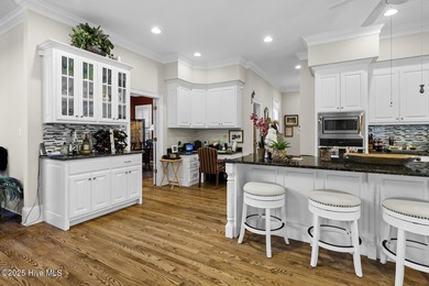 This beautiful brick home in River Landing seamlessly blends on River Landing Golf Course in North Carolina - for sale on GolfHomes.com, golf home, golf lot