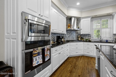 This beautiful brick home in River Landing seamlessly blends on River Landing Golf Course in North Carolina - for sale on GolfHomes.com, golf home, golf lot