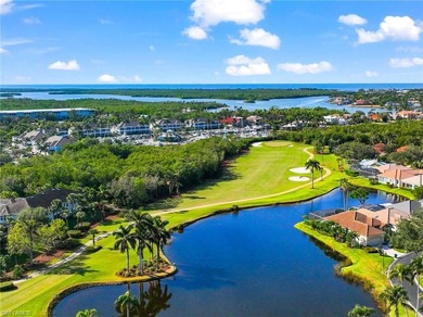 Enjoy spectacular panoramic lake and golf course views from this on Windstar on Naples Bay in Florida - for sale on GolfHomes.com, golf home, golf lot