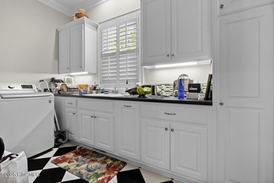 This beautiful brick home in River Landing seamlessly blends on River Landing Golf Course in North Carolina - for sale on GolfHomes.com, golf home, golf lot