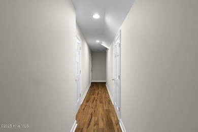 This beautiful brick home in River Landing seamlessly blends on River Landing Golf Course in North Carolina - for sale on GolfHomes.com, golf home, golf lot