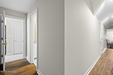 This beautiful brick home in River Landing seamlessly blends on River Landing Golf Course in North Carolina - for sale on GolfHomes.com, golf home, golf lot