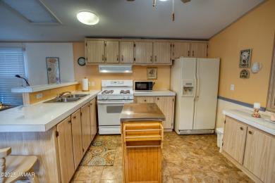 Located in Pinetop Lakes Mobile Homes. Single wide w/shed out on Pinetop Lakes Golf and Country Club in Arizona - for sale on GolfHomes.com, golf home, golf lot