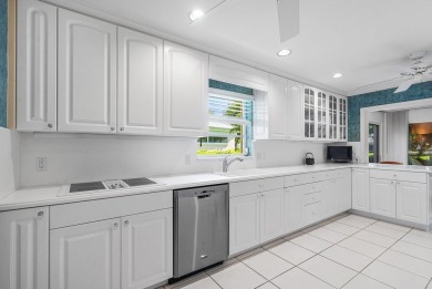Sparkling lake views! Nestled in the Sanderling area of Quail on Quail Ridge Golf Course and Country Club in Florida - for sale on GolfHomes.com, golf home, golf lot