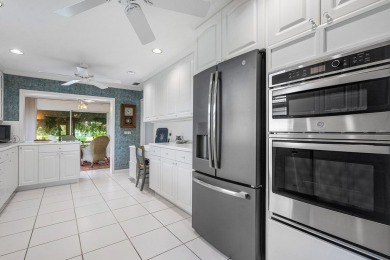 Sparkling lake views! Nestled in the Sanderling area of Quail on Quail Ridge Golf Course and Country Club in Florida - for sale on GolfHomes.com, golf home, golf lot
