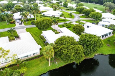 Sparkling lake views! Nestled in the Sanderling area of Quail on Quail Ridge Golf Course and Country Club in Florida - for sale on GolfHomes.com, golf home, golf lot