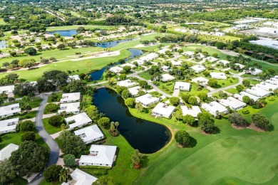 Sparkling lake views! Nestled in the Sanderling area of Quail on Quail Ridge Golf Course and Country Club in Florida - for sale on GolfHomes.com, golf home, golf lot
