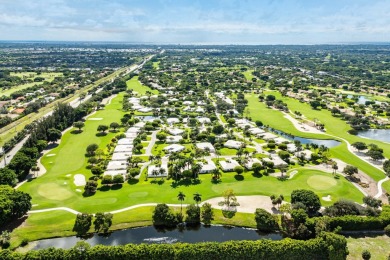 Sparkling lake views! Nestled in the Sanderling area of Quail on Quail Ridge Golf Course and Country Club in Florida - for sale on GolfHomes.com, golf home, golf lot