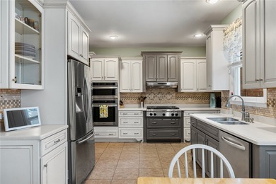 Welcome home to this beautifully maintained 4-bedroom, 2.5-bath on Cobbs Glen Country Club in South Carolina - for sale on GolfHomes.com, golf home, golf lot