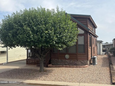 Get a cozy cabin feel in this charming home in desirable Juniper on Juniper Ridge R.V. Golf Resort in Arizona - for sale on GolfHomes.com, golf home, golf lot