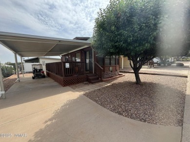 Get a cozy cabin feel in this charming home in desirable Juniper on Juniper Ridge R.V. Golf Resort in Arizona - for sale on GolfHomes.com, golf home, golf lot