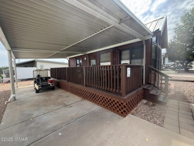 Get a cozy cabin feel in this charming home in desirable Juniper on Juniper Ridge R.V. Golf Resort in Arizona - for sale on GolfHomes.com, golf home, golf lot