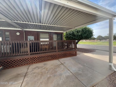 Get a cozy cabin feel in this charming home in desirable Juniper on Juniper Ridge R.V. Golf Resort in Arizona - for sale on GolfHomes.com, golf home, golf lot