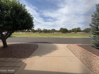 Get a cozy cabin feel in this charming home in desirable Juniper on Juniper Ridge R.V. Golf Resort in Arizona - for sale on GolfHomes.com, golf home, golf lot
