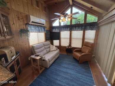 Get a cozy cabin feel in this charming home in desirable Juniper on Juniper Ridge R.V. Golf Resort in Arizona - for sale on GolfHomes.com, golf home, golf lot
