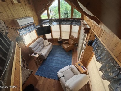 Get a cozy cabin feel in this charming home in desirable Juniper on Juniper Ridge R.V. Golf Resort in Arizona - for sale on GolfHomes.com, golf home, golf lot