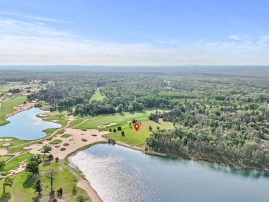 Embrace the pinnacle of golfing luxury with this extraordinary on Forest Dunes Golf Club in Michigan - for sale on GolfHomes.com, golf home, golf lot