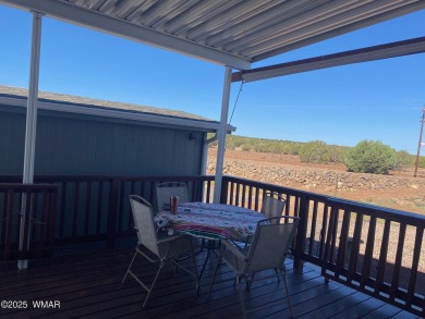 Great Location!  Enjoy the huge deck while watching the sunset on Juniper Ridge R.V. Golf Resort in Arizona - for sale on GolfHomes.com, golf home, golf lot