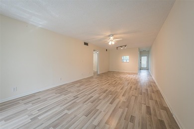 Nestled in the vibrant heart of Wynmoor, an adult community that on Wynmoor Golf Course in Florida - for sale on GolfHomes.com, golf home, golf lot