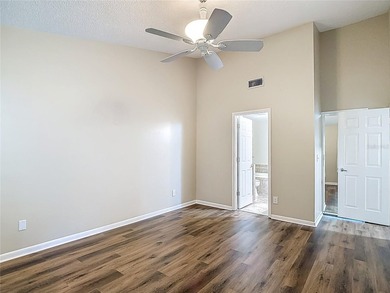 Palm Harbor - Nestled in the gated community of Wescott Square on Tarpon Woods Golf Club in Florida - for sale on GolfHomes.com, golf home, golf lot