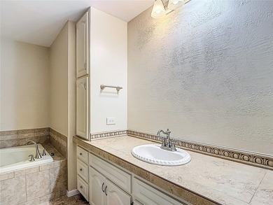 Palm Harbor - Nestled in the gated community of Wescott Square on Tarpon Woods Golf Club in Florida - for sale on GolfHomes.com, golf home, golf lot