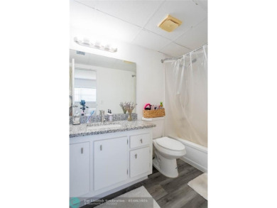 Discover the perfect blend of comfort and convenience in this on Oriole Golf and Tennis Club in Florida - for sale on GolfHomes.com, golf home, golf lot