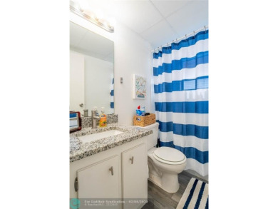 Discover the perfect blend of comfort and convenience in this on Oriole Golf and Tennis Club in Florida - for sale on GolfHomes.com, golf home, golf lot