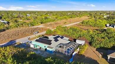 Tropical Paradise Living - No HOA!  ** THE FENCE IN THE BACK IS on Duffys Golf Center in Florida - for sale on GolfHomes.com, golf home, golf lot
