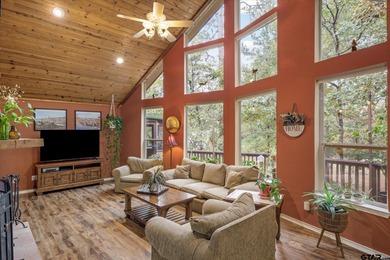 An absolute 3/3/2+ dream home in highly sought after gated on Holly Lake Ranch Golf Club in Texas - for sale on GolfHomes.com, golf home, golf lot